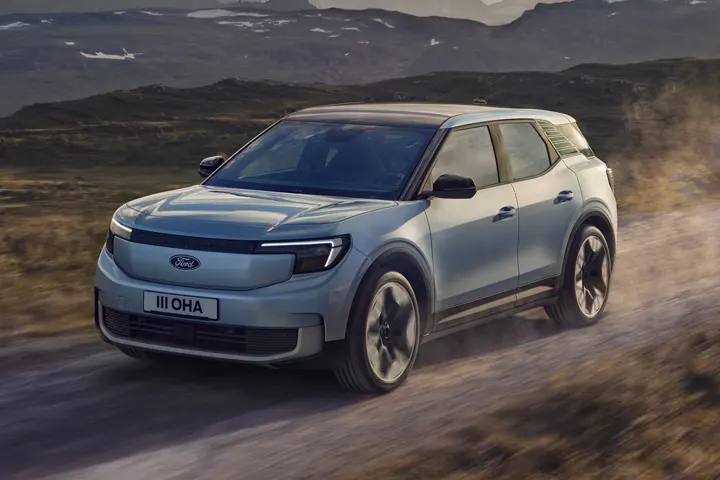 2025 Ford Explorer EV front view — European all-electric SUV with modern closed grille, LED headlights and bold stance