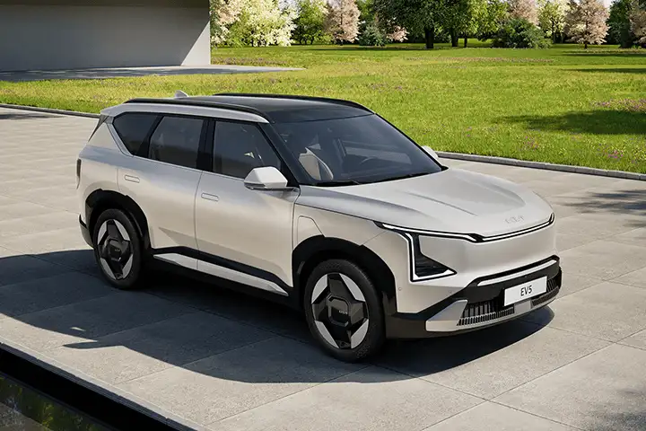 Kia EV5 front view with Star Map LED lights and aerodynamic SUV design.