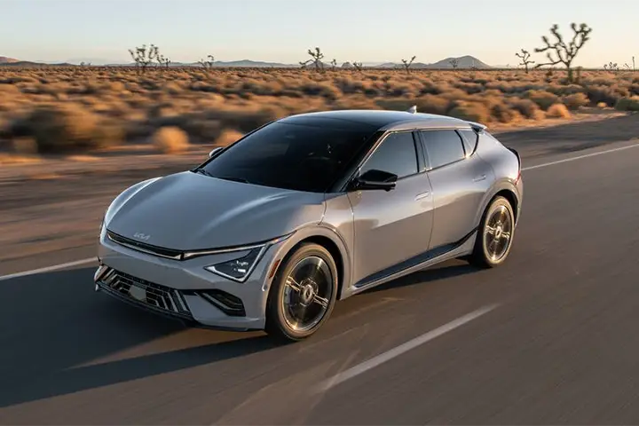 Front view of the Kia EV6 (2025 facelift) electric crossover, showing redesigned LED headlights, updated bumper styling, and aerodynamic improvements with 800 V fast-charging capability.