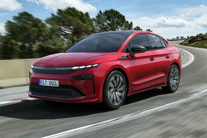 Front view of the Škoda Enyaq Coupé electric SUV with illuminated grille and LED headlights