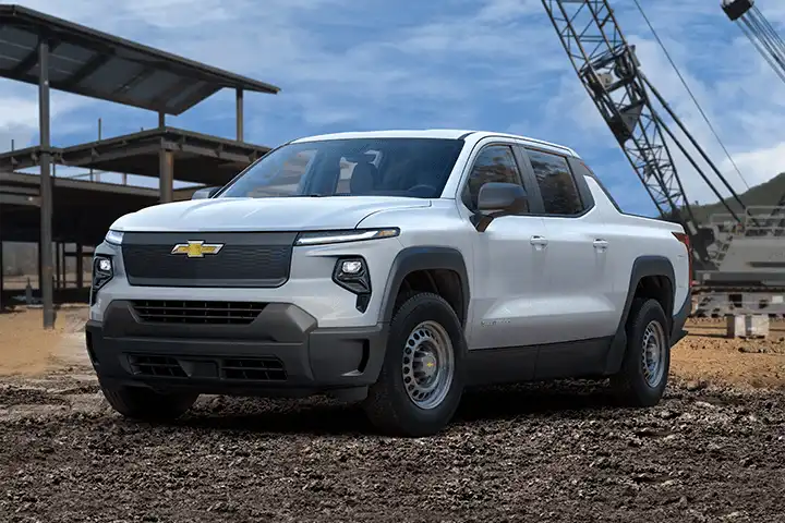 Front view of the Chevrolet Silverado EV electric pickup truck, showing closed grille, LED signature lights, and spacious eTrunk storage built on Ultium 800V.