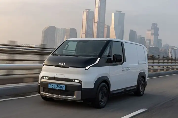 Front view of Kia PV5 Cargo electric van with modular box design and low flat loading floor.